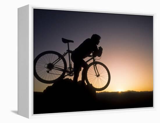 Silhouette of Mountain Biker at the Summit During Sunrise-null-Framed Premier Image Canvas