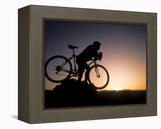 Silhouette of Mountain Biker at the Summit During Sunrise-null-Framed Premier Image Canvas