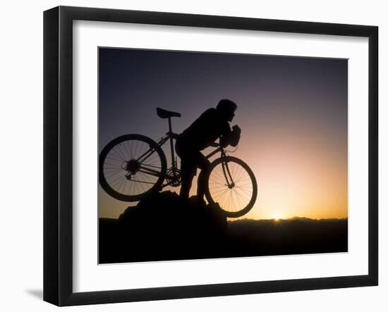 Silhouette of Mountain Biker at the Summit During Sunrise-null-Framed Photographic Print