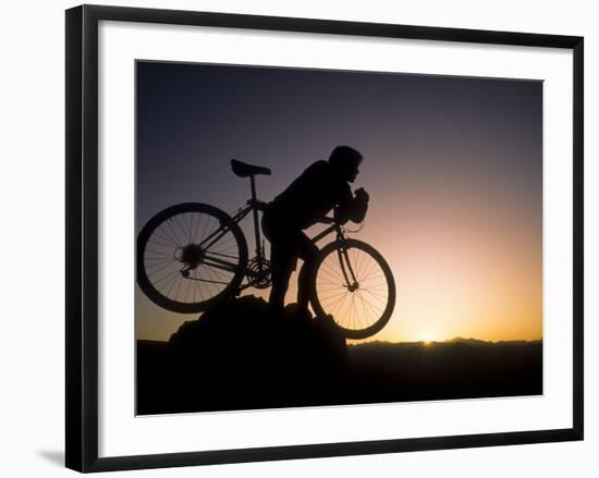 Silhouette of Mountain Biker at the Summit During Sunrise-null-Framed Photographic Print