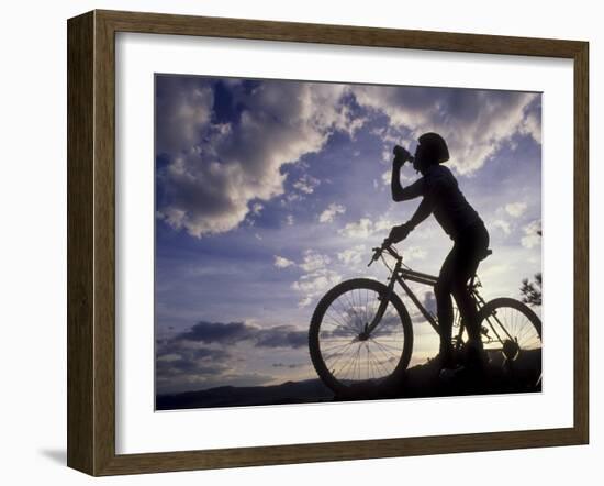 Silhouette of Mountain Biker Drinking at the Summit During Sunset-null-Framed Photographic Print