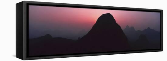 Silhouette of rock formations at dusk, Seven Star Park, Guilin, China-Panoramic Images-Framed Premier Image Canvas