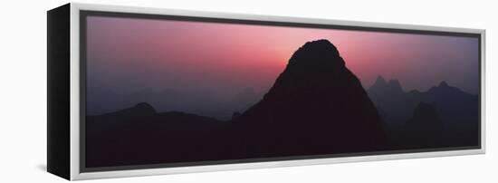 Silhouette of rock formations at dusk, Seven Star Park, Guilin, China-Panoramic Images-Framed Premier Image Canvas