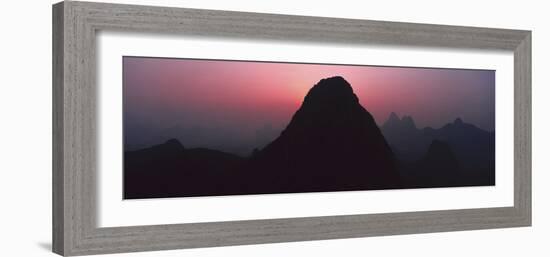 Silhouette of rock formations at dusk, Seven Star Park, Guilin, China-Panoramic Images-Framed Photographic Print