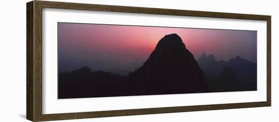 Silhouette of rock formations at dusk, Seven Star Park, Guilin, China-Panoramic Images-Framed Photographic Print