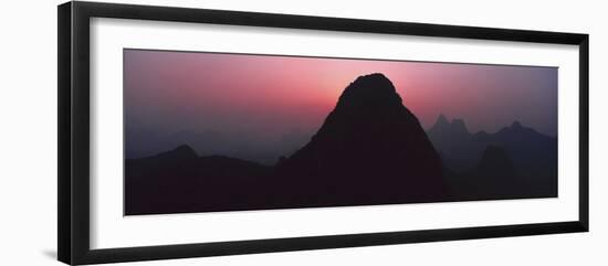Silhouette of rock formations at dusk, Seven Star Park, Guilin, China-Panoramic Images-Framed Photographic Print