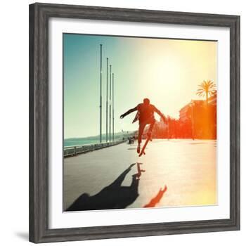 Silhouette of Skateboarder Jumping in City on Background of Promenade and Sea-Maxim Blinkov-Framed Photographic Print