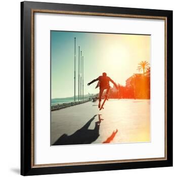 Silhouette of Skateboarder Jumping in City on Background of Promenade and Sea-Maxim Blinkov-Framed Photographic Print