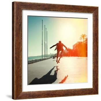 Silhouette of Skateboarder Jumping in City on Background of Promenade and Sea-Maxim Blinkov-Framed Photographic Print