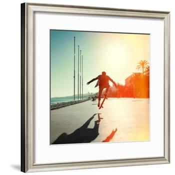 Silhouette of Skateboarder Jumping in City on Background of Promenade and Sea-Maxim Blinkov-Framed Photographic Print