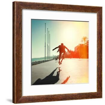 Silhouette of Skateboarder Jumping in City on Background of Promenade and Sea-Maxim Blinkov-Framed Photographic Print