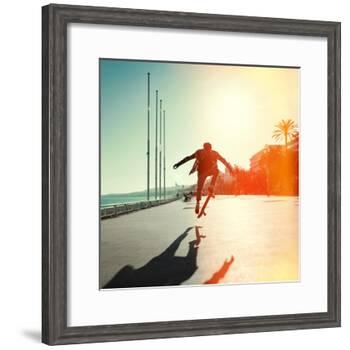 Silhouette of Skateboarder Jumping in City on Background of Promenade and Sea-Maxim Blinkov-Framed Photographic Print