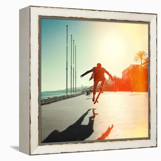 Silhouette of Skateboarder Jumping in City on Background of Promenade and Sea-Maxim Blinkov-Framed Stretched Canvas