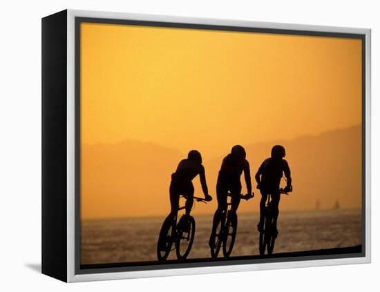 Silhouette of Three Men Riding on the Beach-Mitch Diamond-Framed Premier Image Canvas