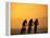 Silhouette of Three Men Riding on the Beach-Mitch Diamond-Framed Premier Image Canvas