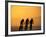 Silhouette of Three Men Riding on the Beach-Mitch Diamond-Framed Photographic Print