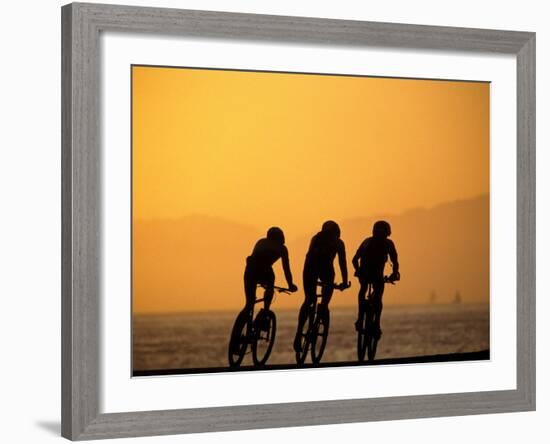 Silhouette of Three Men Riding on the Beach-Mitch Diamond-Framed Photographic Print