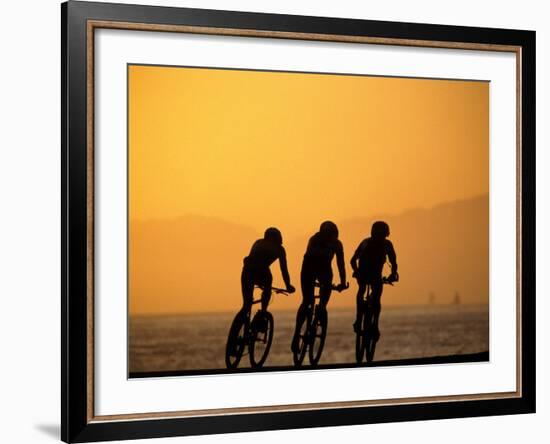 Silhouette of Three Men Riding on the Beach-Mitch Diamond-Framed Photographic Print