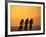 Silhouette of Three Men Riding on the Beach-Mitch Diamond-Framed Photographic Print