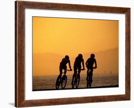 Silhouette of Three Men Riding on the Beach-Mitch Diamond-Framed Photographic Print