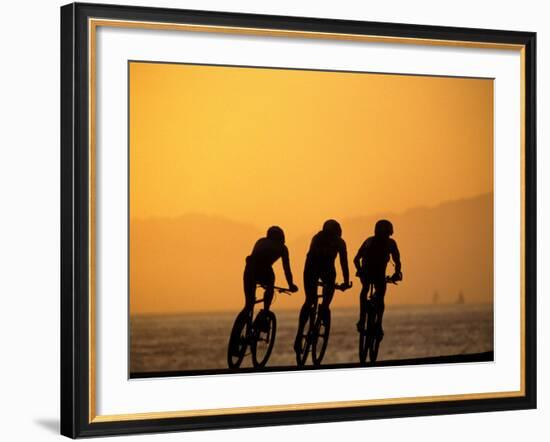 Silhouette of Three Men Riding on the Beach-Mitch Diamond-Framed Photographic Print