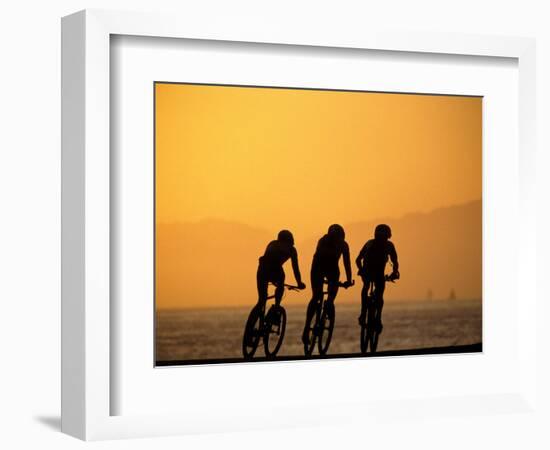 Silhouette of Three Men Riding on the Beach-Mitch Diamond-Framed Premium Photographic Print