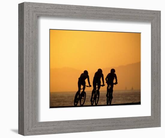 Silhouette of Three Men Riding on the Beach-Mitch Diamond-Framed Photographic Print