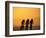 Silhouette of Three Men Riding on the Beach-Mitch Diamond-Framed Photographic Print