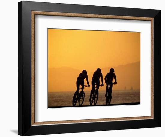 Silhouette of Three Men Riding on the Beach-Mitch Diamond-Framed Photographic Print