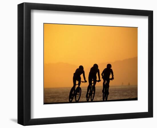 Silhouette of Three Men Riding on the Beach-Mitch Diamond-Framed Photographic Print