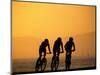 Silhouette of Three Men Riding on the Beach-Mitch Diamond-Mounted Photographic Print