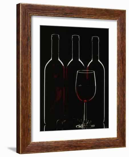 Silhouette of Three Red Wine Bottles and One Red Wine Glass-Walter Cimbal-Framed Photographic Print