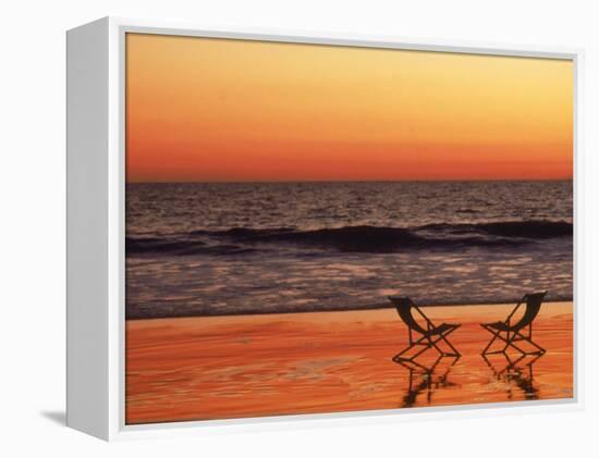 Silhouette of Two Chairs on the Beach-Mitch Diamond-Framed Premier Image Canvas