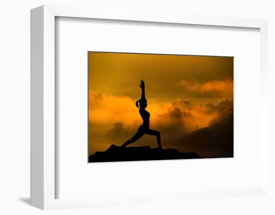 Silhouette of Woman Doing Yoga Meditation During Sunrise with Natural Golden Sunlight on Mountain-szefei-Framed Photographic Print