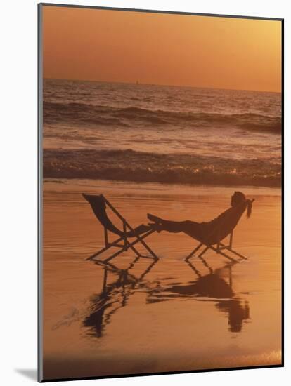 Silhouette of Woman in Beach Chair on the Beach-Mitch Diamond-Mounted Photographic Print