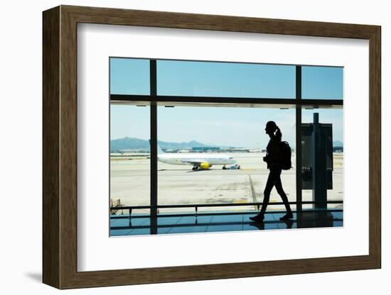 Silhouette of Young Woman Walking at Airport-Nomad Soul-Framed Photographic Print