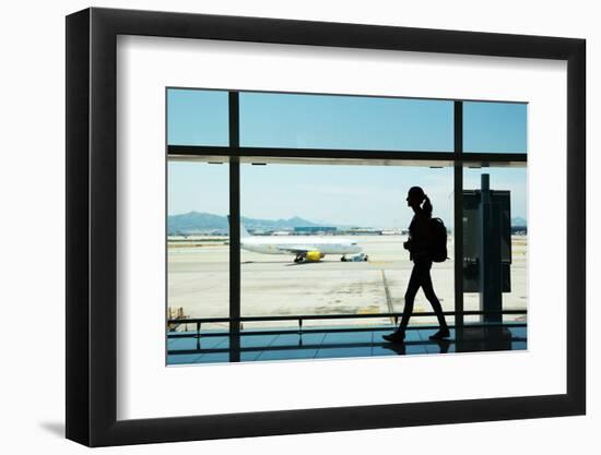 Silhouette of Young Woman Walking at Airport-Nomad Soul-Framed Photographic Print