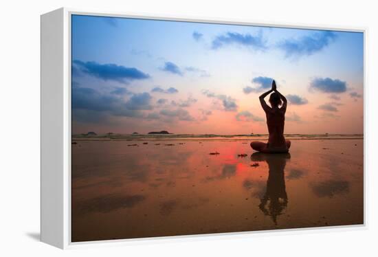 Silhouette Young Woman Practicing Yoga On The Beach At Sunset-De Visu-Framed Stretched Canvas