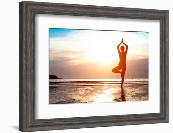 Silhouette Young Woman Practicing Yoga on the Beach at Sunset-De Visu-Framed Photographic Print