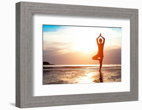 Silhouette Young Woman Practicing Yoga on the Beach at Sunset-De Visu-Framed Photographic Print