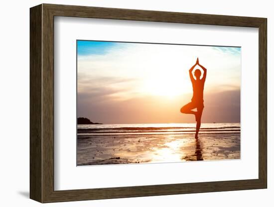 Silhouette Young Woman Practicing Yoga on the Beach at Sunset-De Visu-Framed Photographic Print