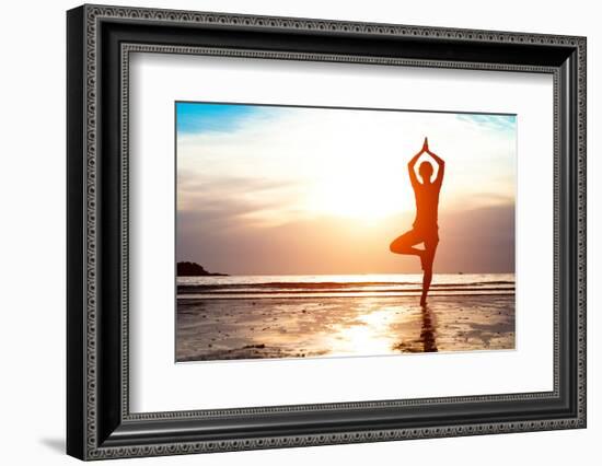 Silhouette Young Woman Practicing Yoga on the Beach at Sunset-De Visu-Framed Photographic Print