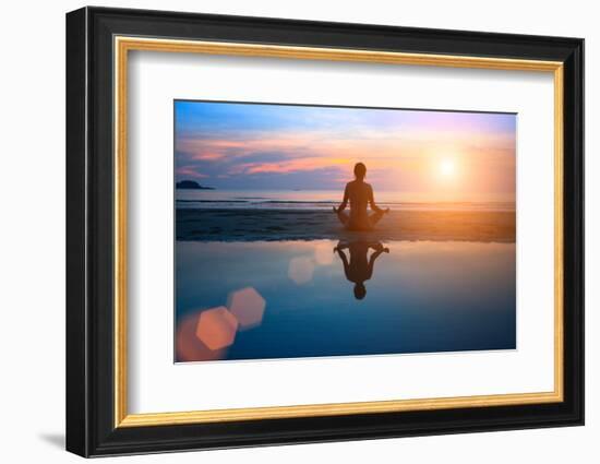 Silhouette Young Woman Practicing Yoga on the Beach at Sunset-De Visu-Framed Photographic Print