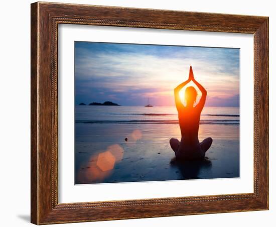 Silhouette Young Woman Practicing Yoga on the Beach at Sunset.-De Visu-Framed Photographic Print