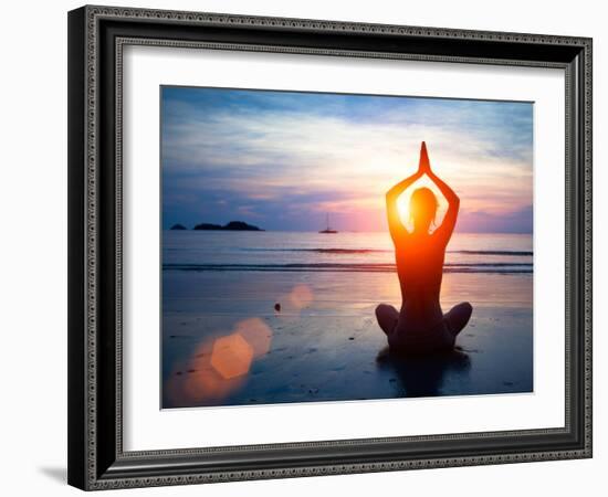 Silhouette Young Woman Practicing Yoga on the Beach at Sunset.-De Visu-Framed Photographic Print