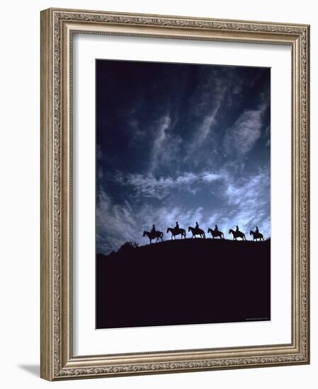 Silhouetted Cowboys During Round Up at Trinchera Ranch-Loomis Dean-Framed Photographic Print