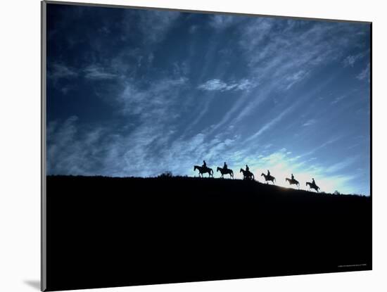 Silhouetted Cowboys During Round Up at Trinchera Ranch-Loomis Dean-Mounted Photographic Print