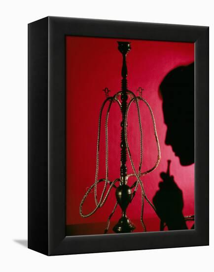 Silhouetted Man Smoking Cannabis From a Pipe-Tek Image-Framed Premier Image Canvas