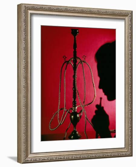 Silhouetted Man Smoking Cannabis From a Pipe-Tek Image-Framed Photographic Print