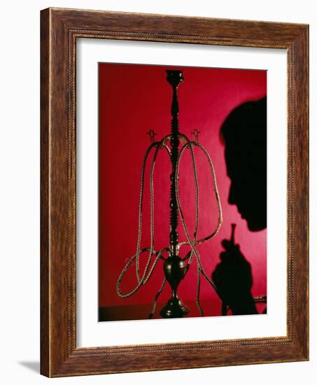 Silhouetted Man Smoking Cannabis From a Pipe-Tek Image-Framed Photographic Print